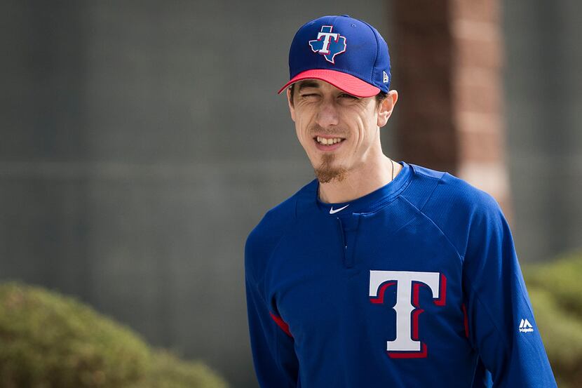 Texas Rangers pitcher Tim Lincecum takes the field for a spring training workout at the...