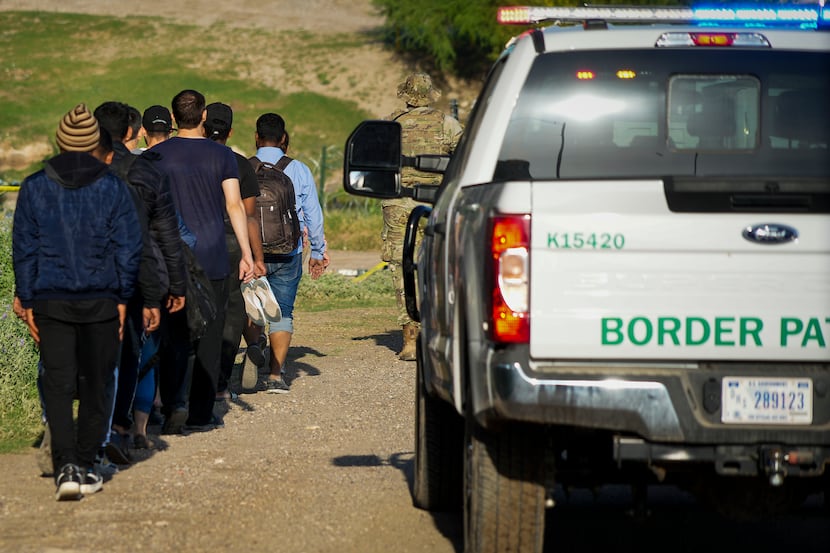 A group of migrants, who had turned themselves in to authorities near the Eagle Pass...