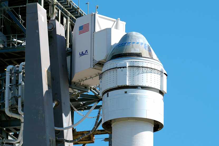 Boeing's Starliner capsule, atop an Atlas V rocket, sits on the launch pad at Space Launch...