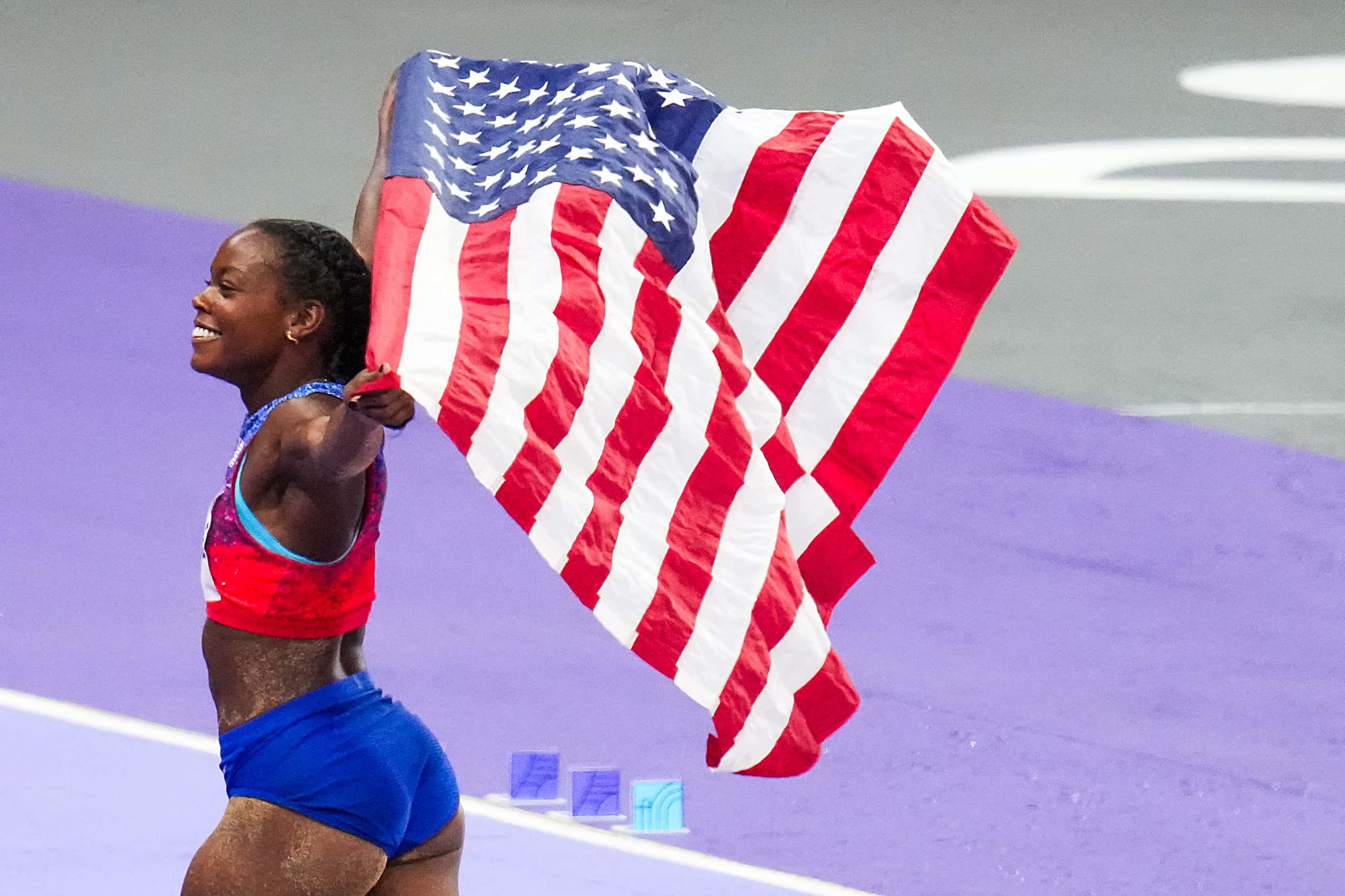 Jasmine Moore of the United States celebrates after winning the bronze medal in the women’s...