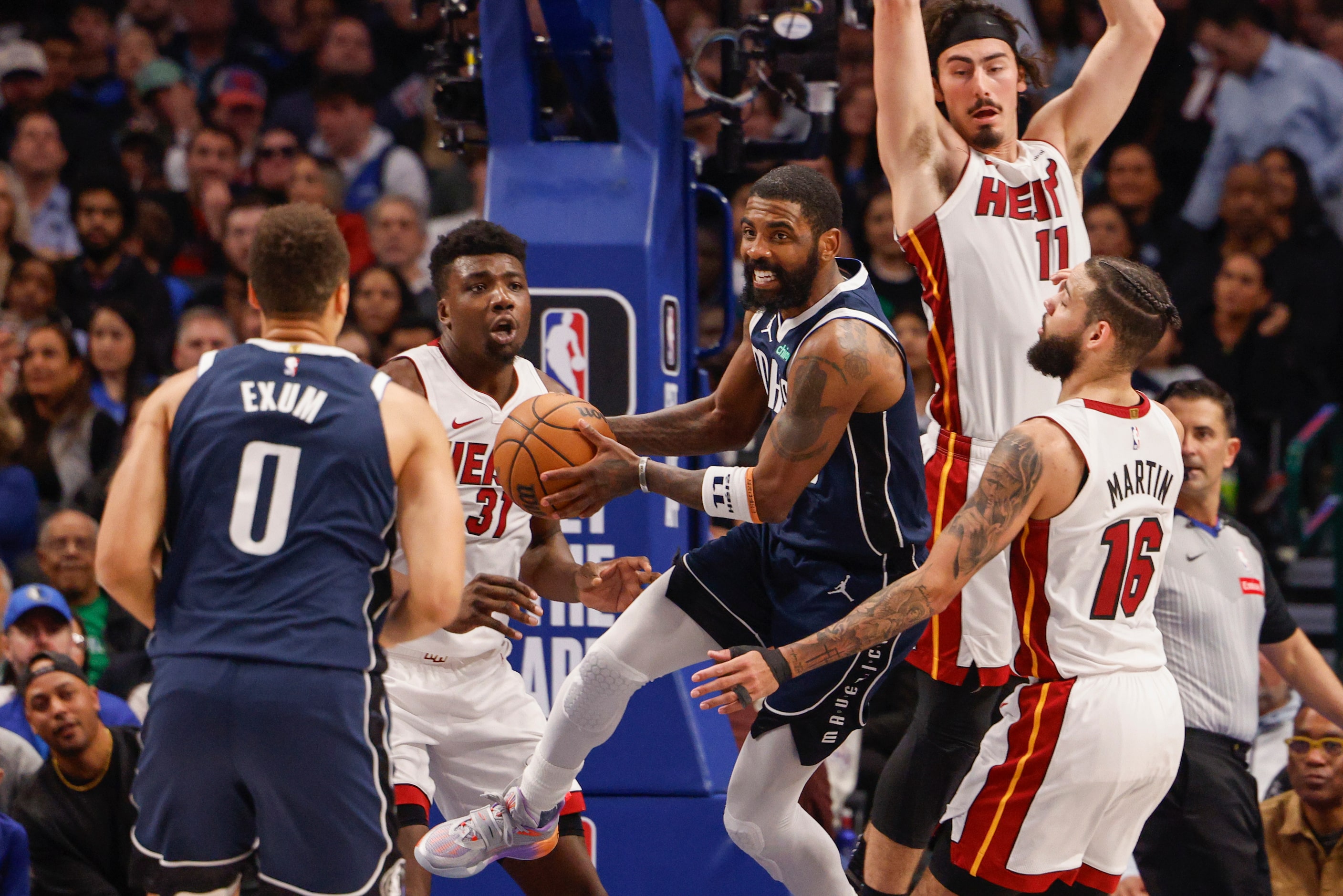 Dallas Mavericks guard Kyrie Irving (11) looks to pass as Miami Heat guard Jaime Jaquez Jr....