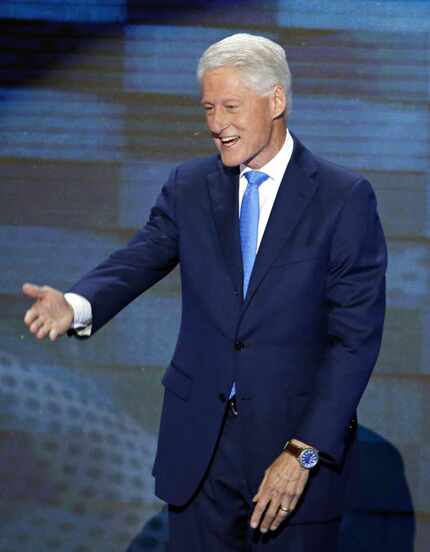 Former president Bill Clinton walks on stage to deliver the keynote address during the...
