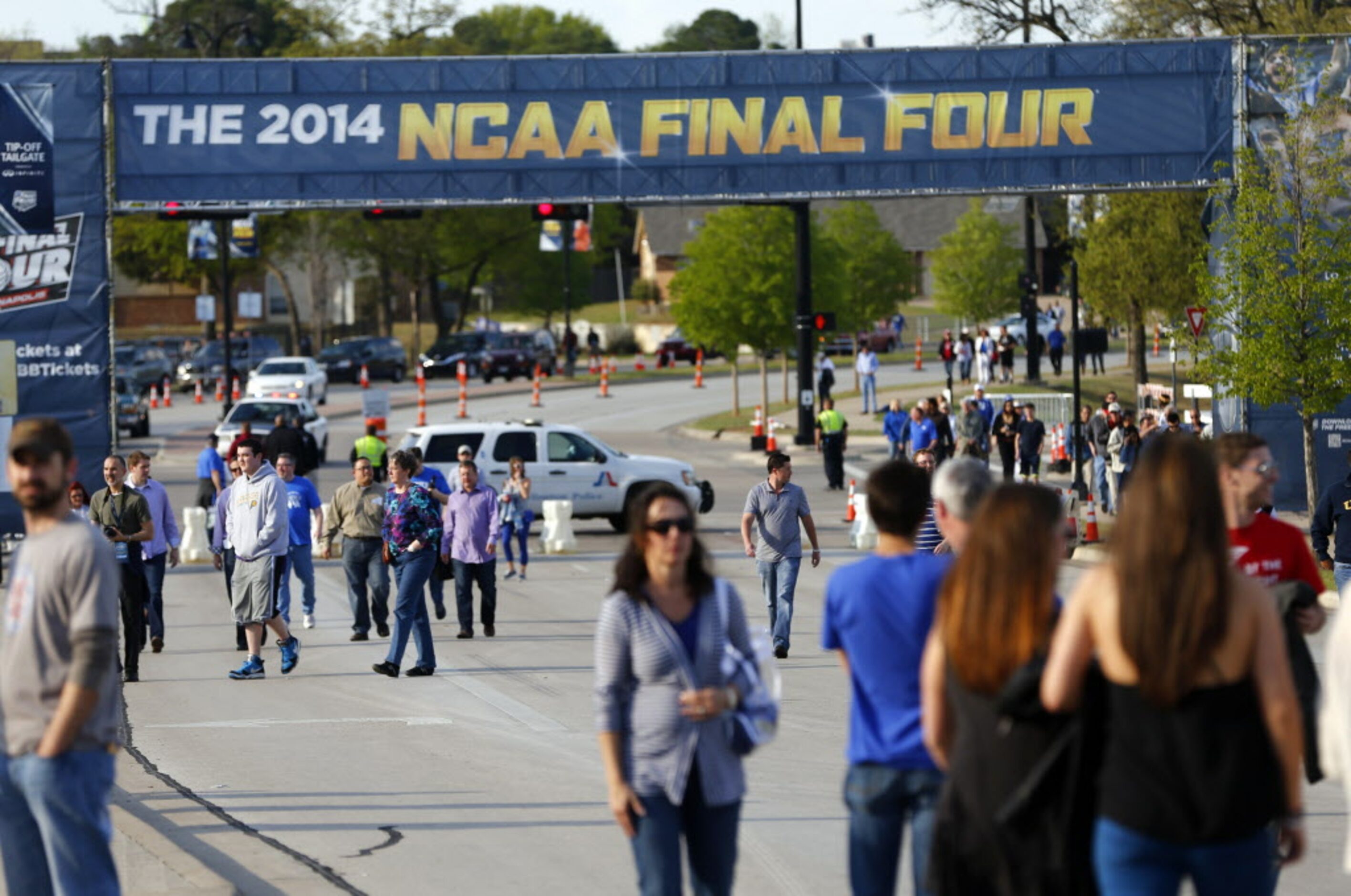 People walk towards the Tip-Off Tailgate party before the game between the Kentucky Wildcats...