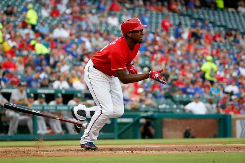 Texas Rangers' Jurickson Profar watches his double during the first inning against Oakland...