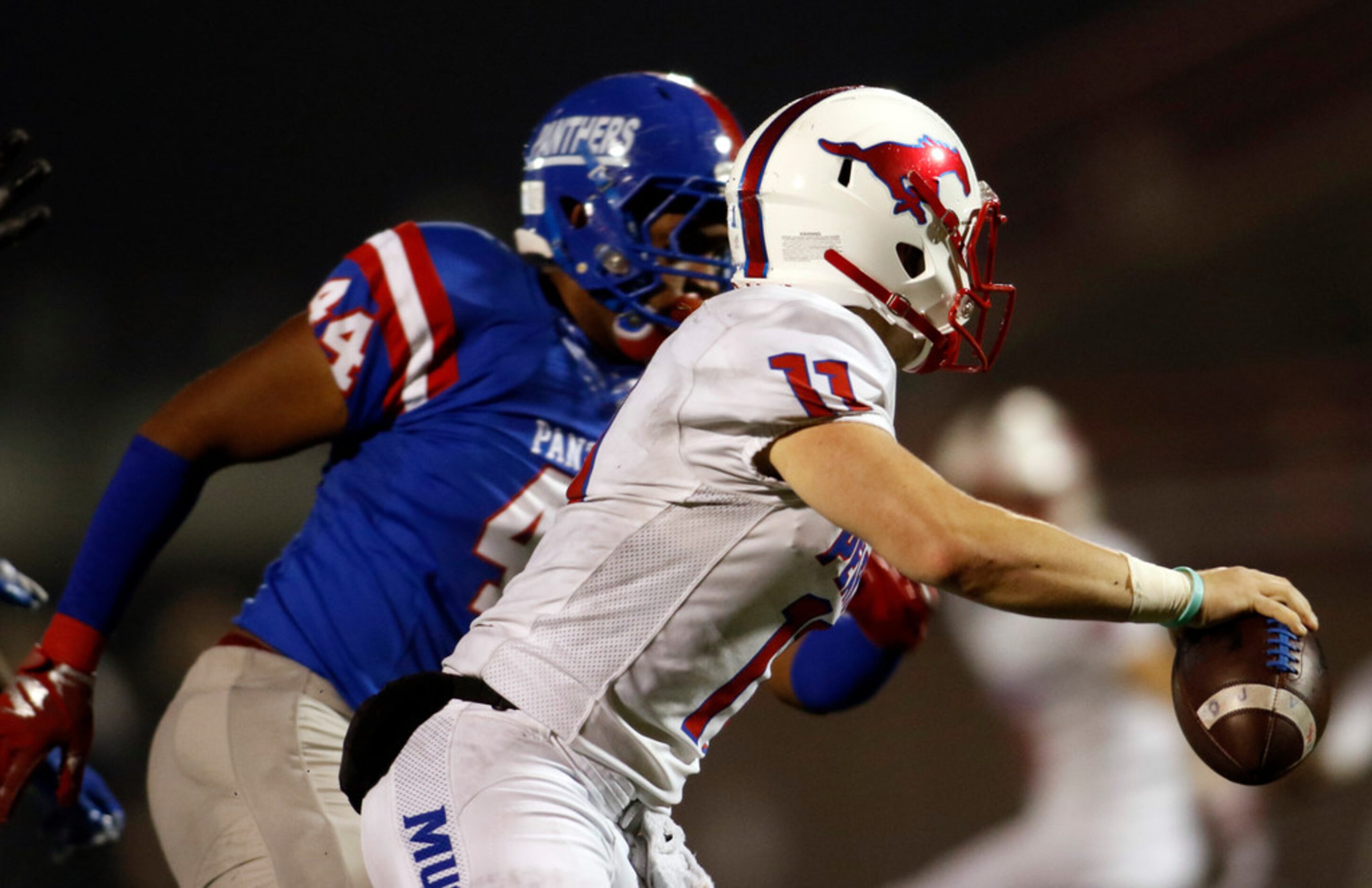 Richardson Pearce quarterback Bo Brewer (11) rolls out of the pocket to avoid the rush from...