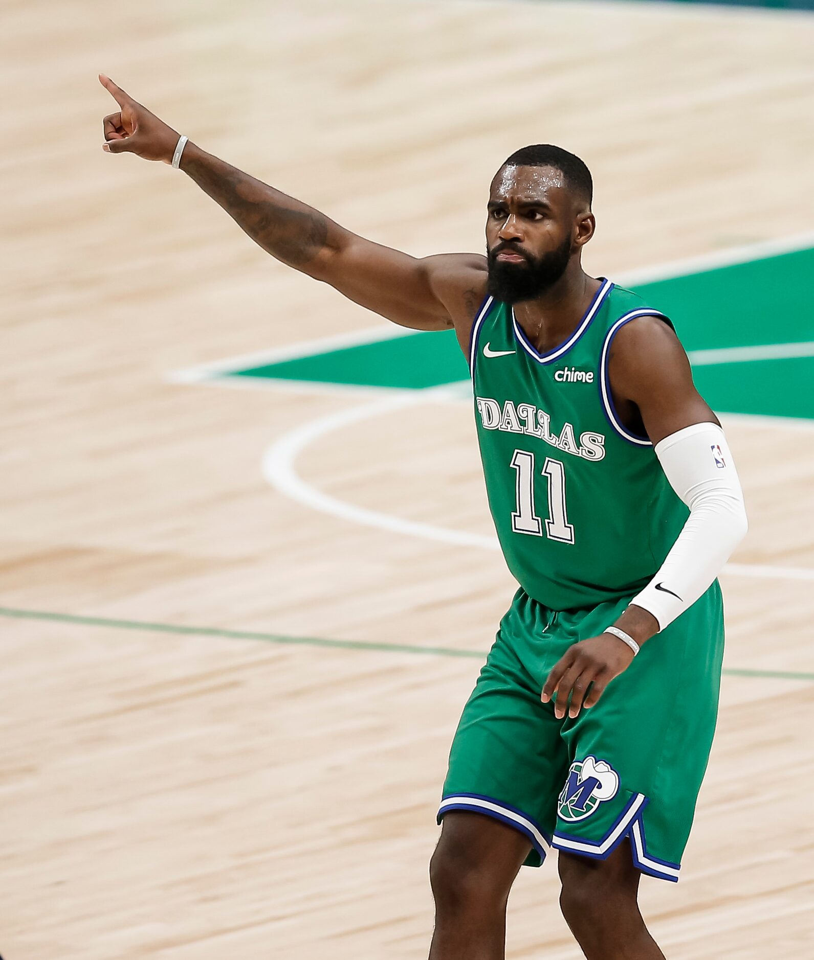 Dallas Mavericks forward Tim Hardaway Jr. (11) celebrates scoring a three-point shot during...