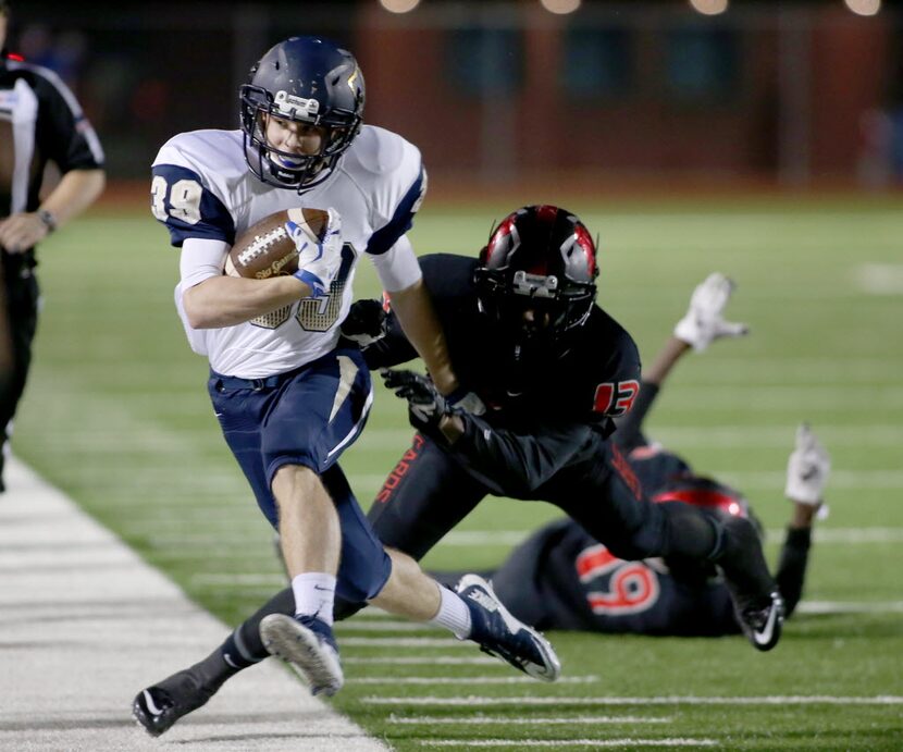 Irving MacArthur’s Rashad Fisher (13) pushes out of bounds Jesuit’s Fletcher Rosenbleeth...