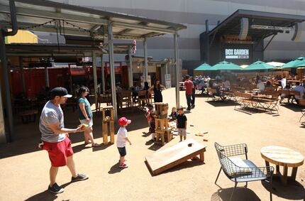 Patrons can play with building blocks and other outdoor games at the Box Garden at Legacy Hall.