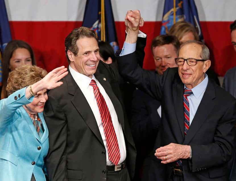 Democratic New York Gov. Andrew Cuomo (second from left) celebrated with his father, former...