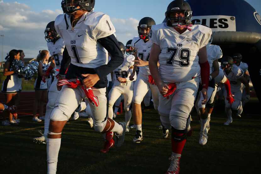 Episcopal School of Dallas players enter the field before a game in 2016. (Andy...