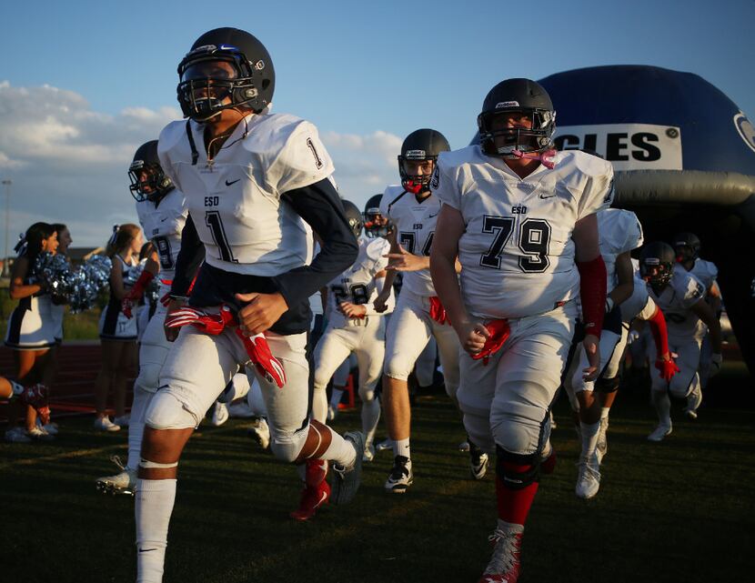Episcopal School of Dallas players enter the field before a game in 2016. (Andy...