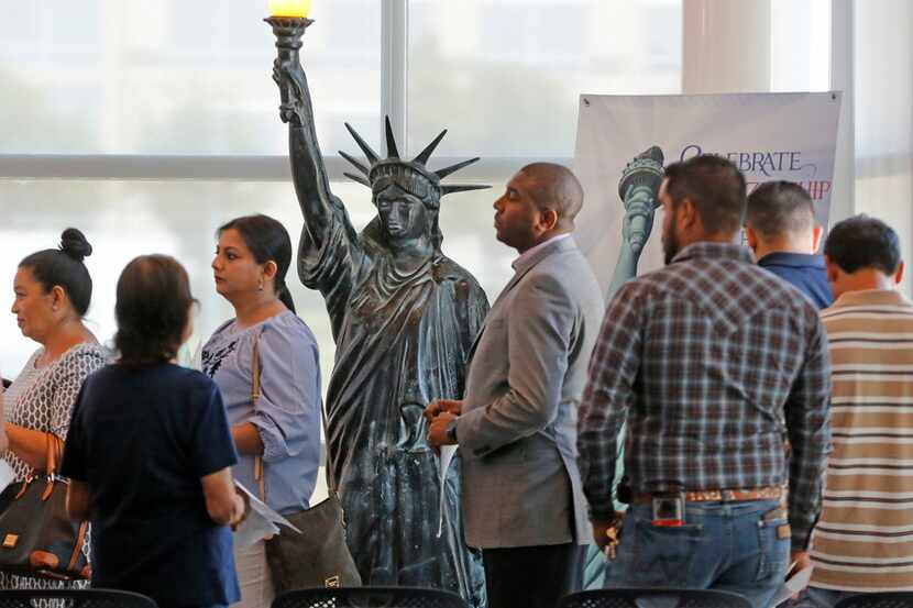 Immigrants, such as these at a citizenship ceremony last year in Irving, are a big part of...