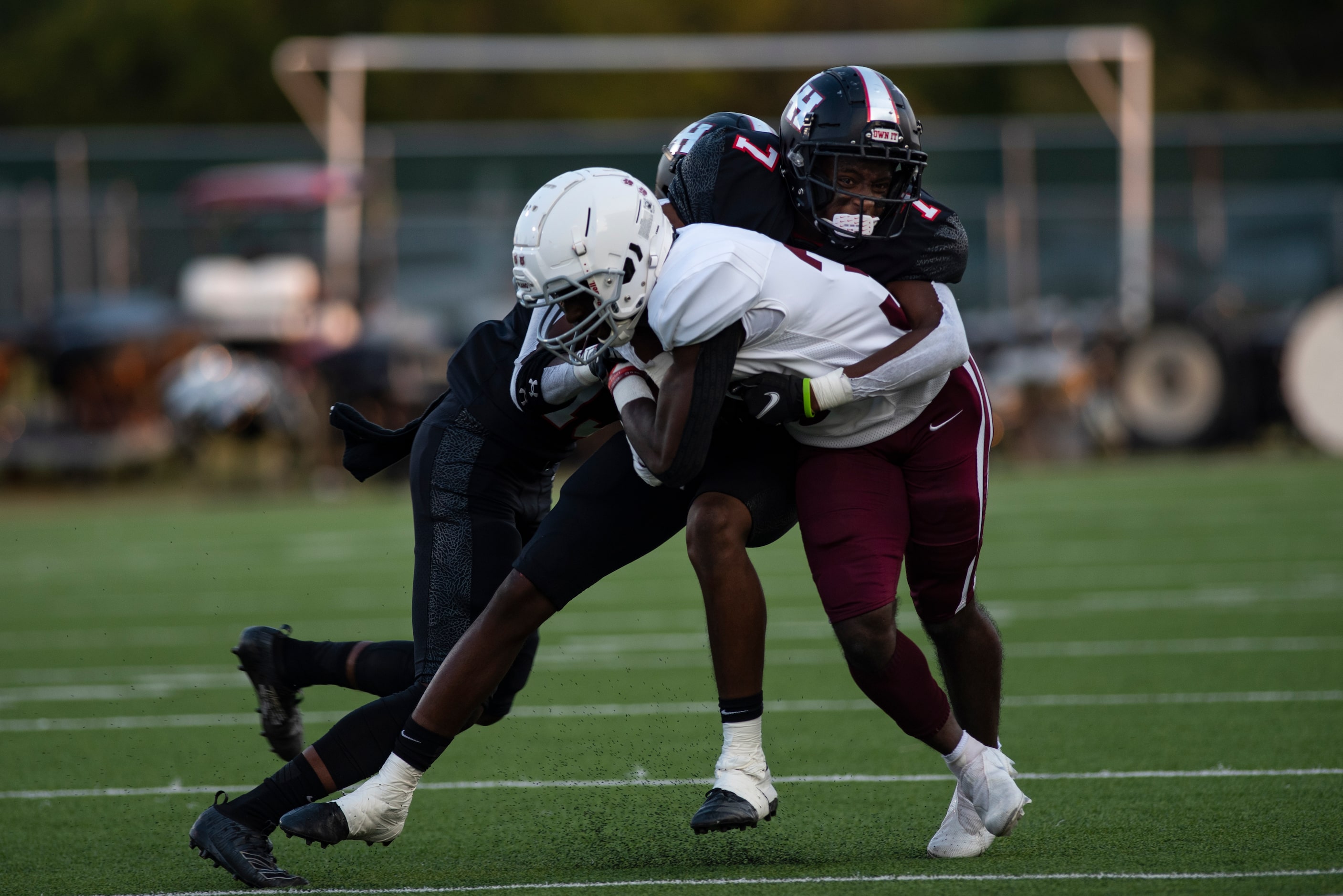 Plano Senior High School senior Ian Minter (32) is tackled during Lake HighlandÕs home game...