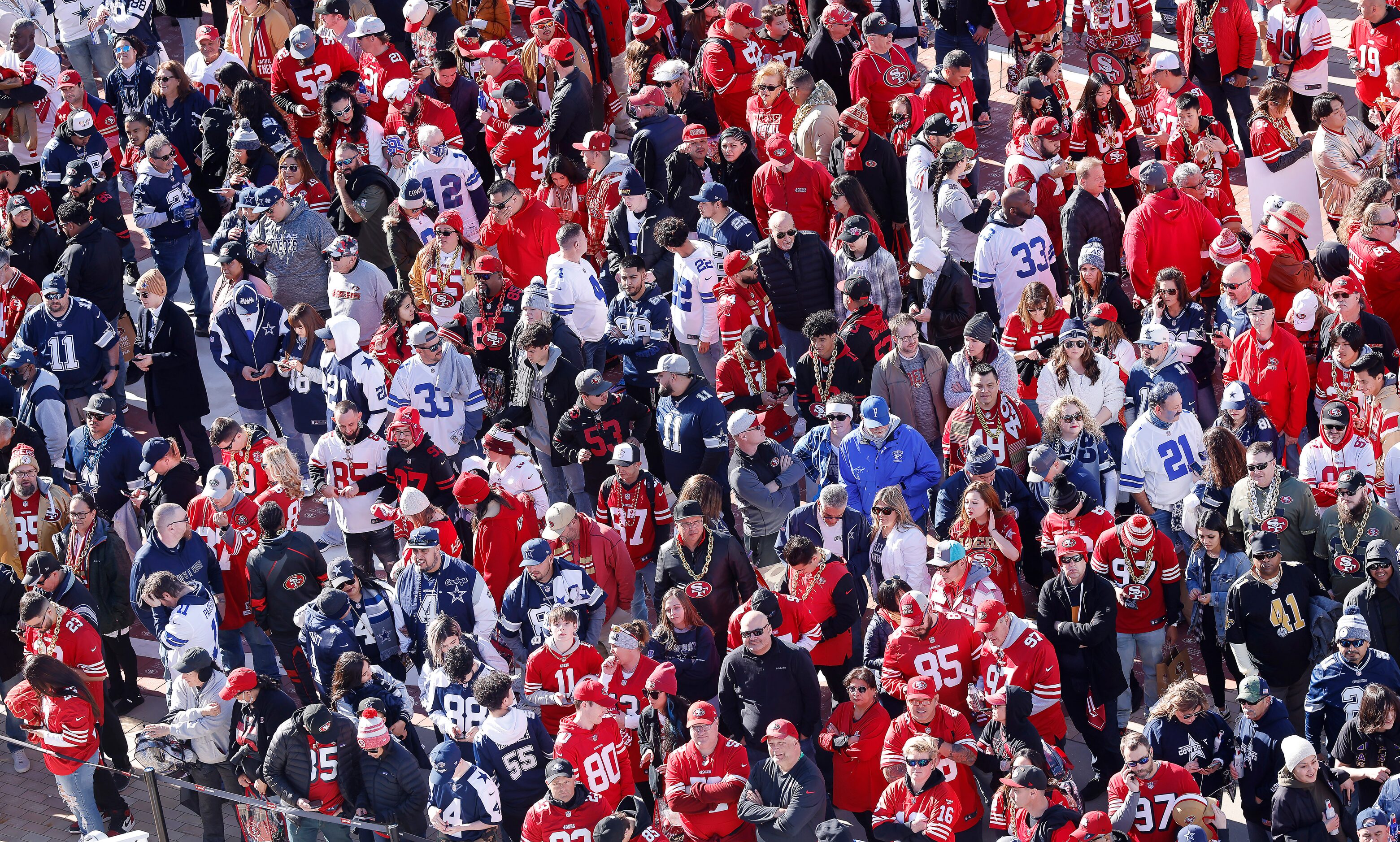 Dallas Cowboys and San Francisco 49ers fans wait to get into Levi’s Stadium in Santa Clara,...