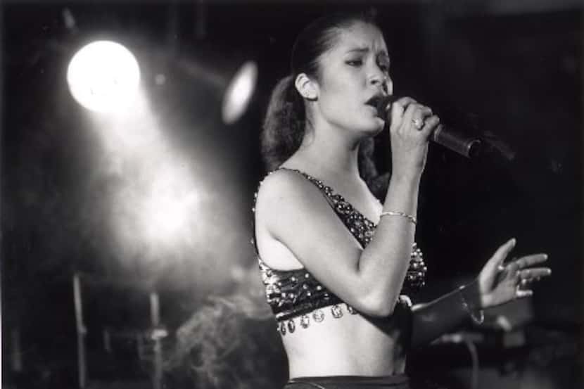 Selena Quintanilla performs for the crowd during a dance following the Feria de las Flores...