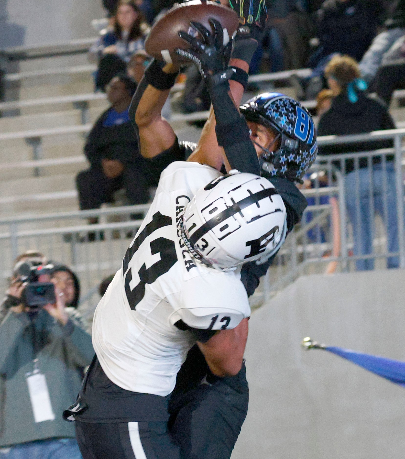 North Crowley's Kevin Moore (3) catches a touchdown pass against Permian's Nata Cardoza (13)...