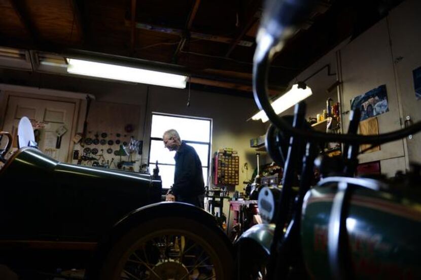 
Mack, 91, moves equipment around in his garage in Dallas. Mack is a vintage car collector...