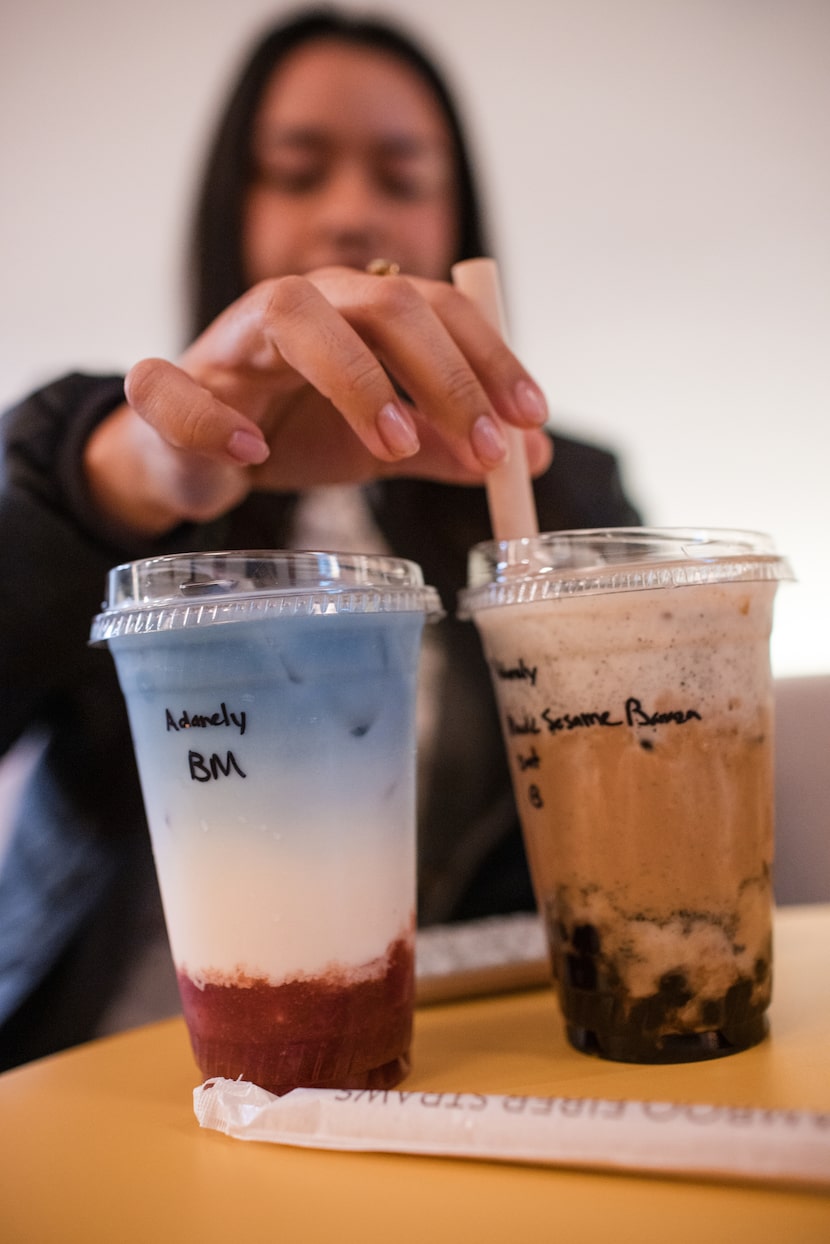 Adanely Medina puts a straw in a boba drink during a pop-up event for The Boba Plug at the...