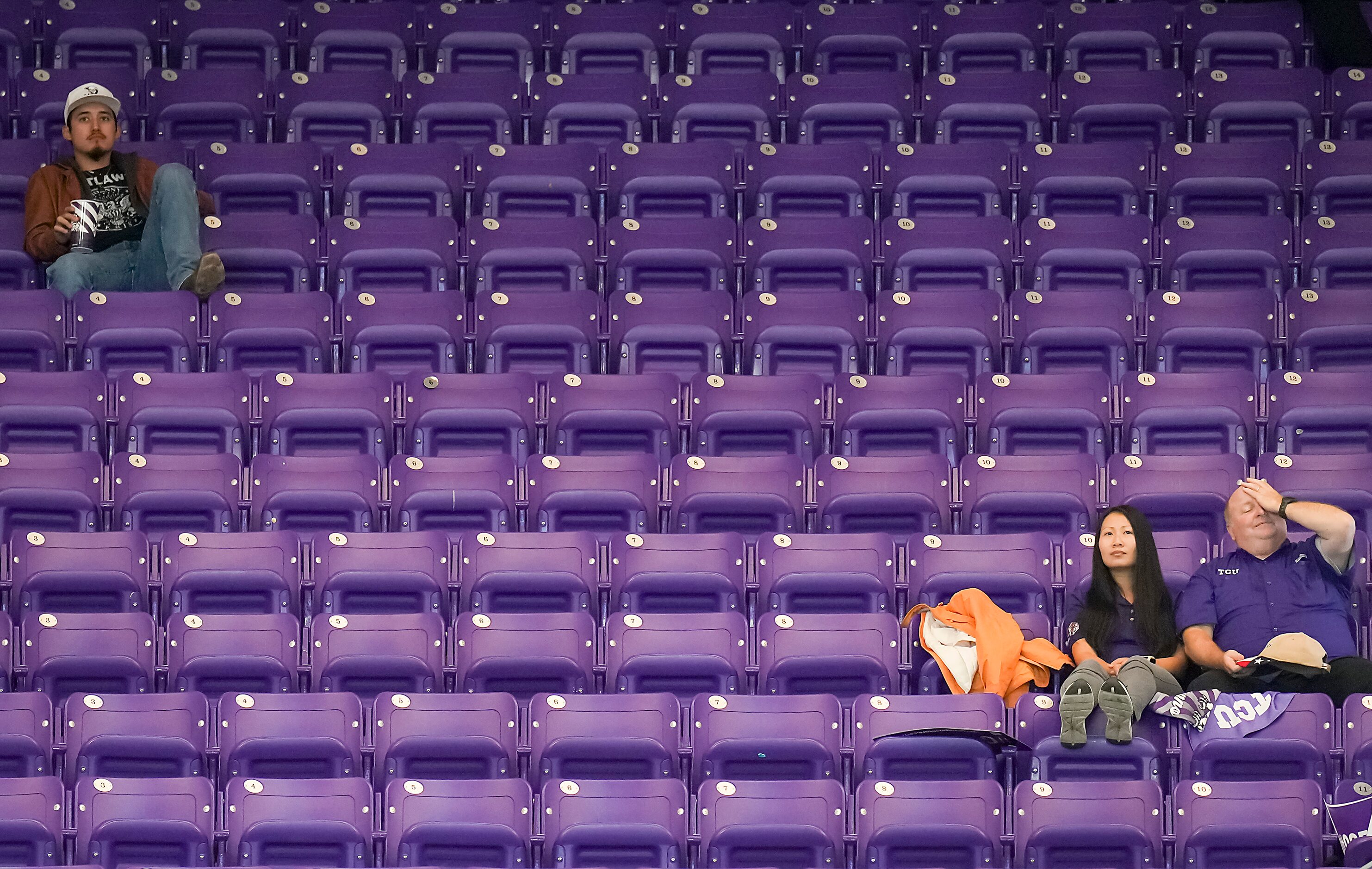 TCU fans watch the fourth quarter of a loss to Georgia during a College Football Playoff...