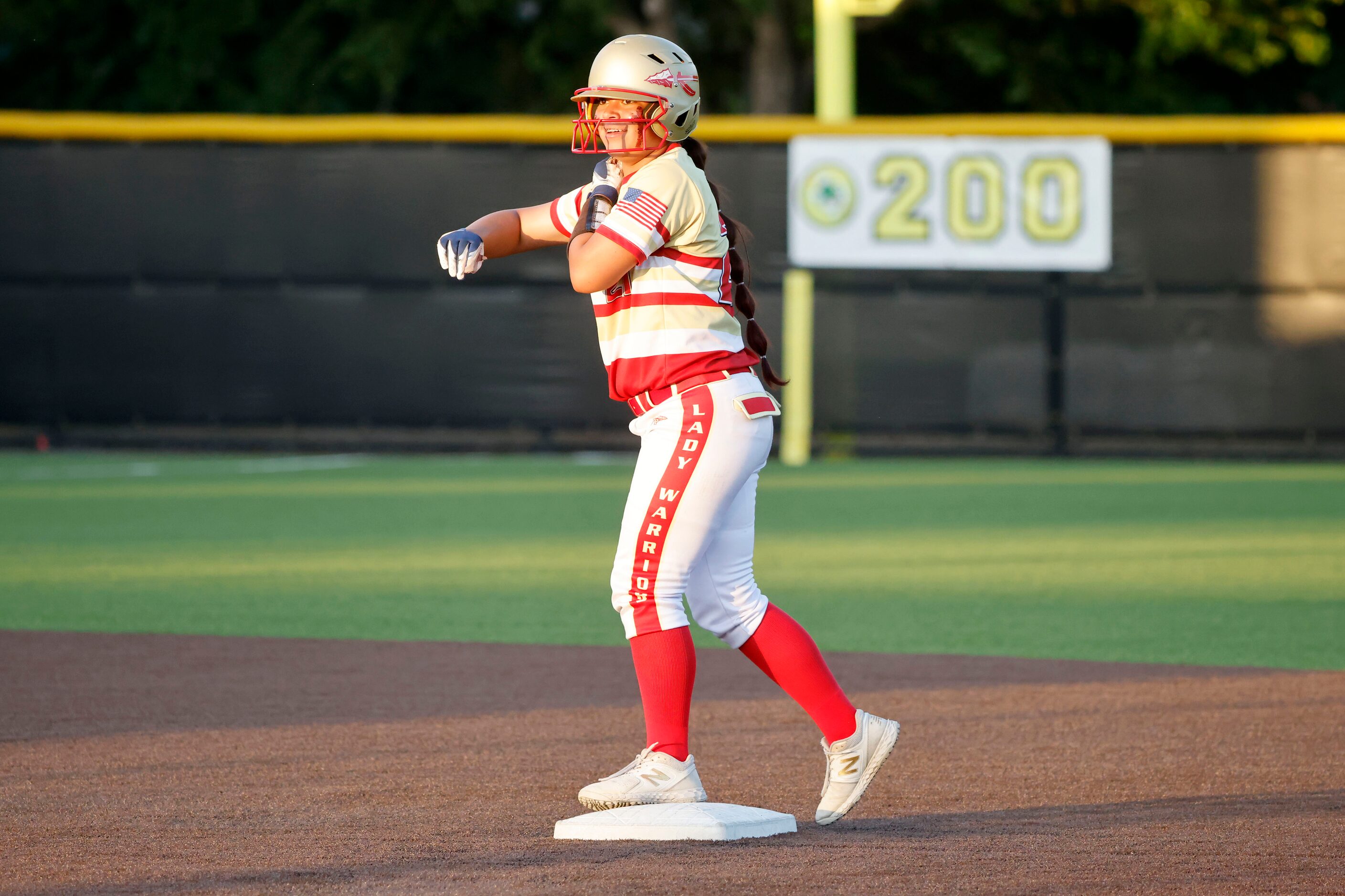 South Grand Prarie’s  Adriana Mountcastle (21) celebrates a run-scoring double against Allen...