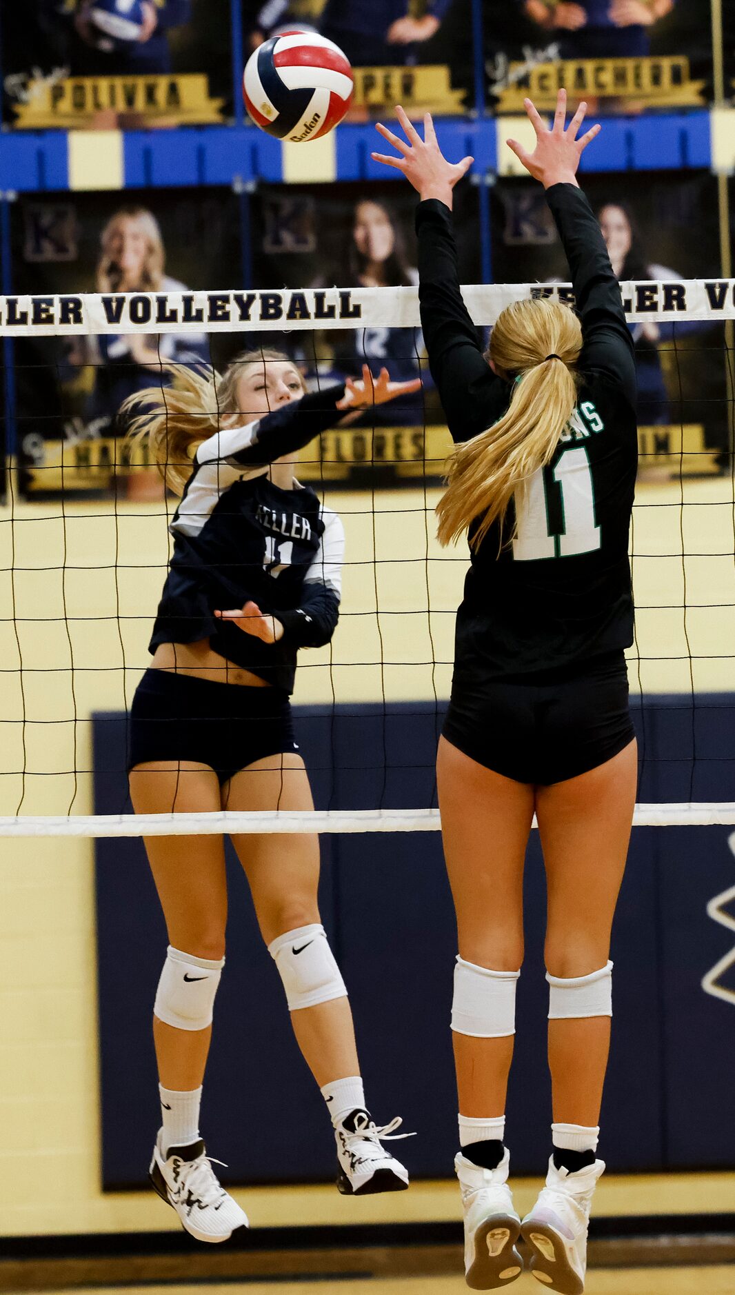 Keller’s Brooklyn Harter (11) hits the ball over Southlake Carroll’s Layla Austin (11)...