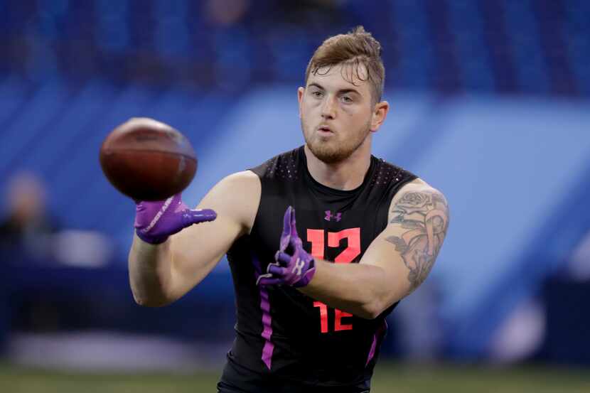 San Diego State tight end David Wells runs a drill at the NFL football scouting combine in...