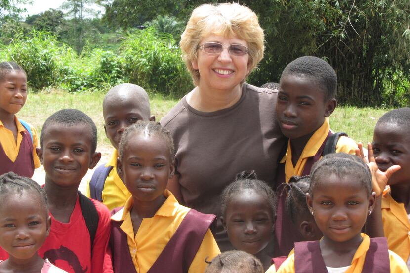 Nancy Writebol, with children in Liberia, is one of two Americans working for a missionary...