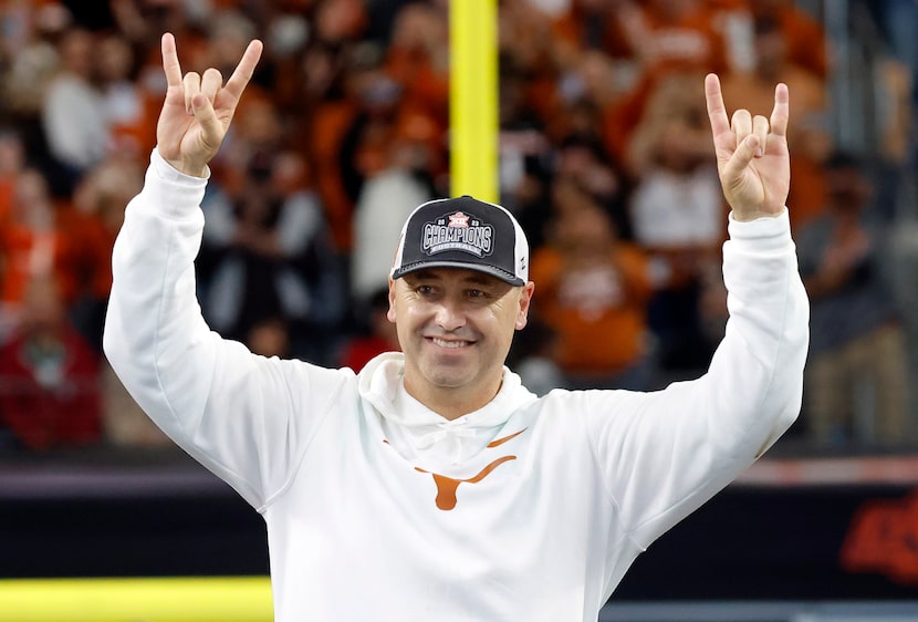 Texas Longhorns head coach Steve Sarkisian throws up the horns after his team defeated the...