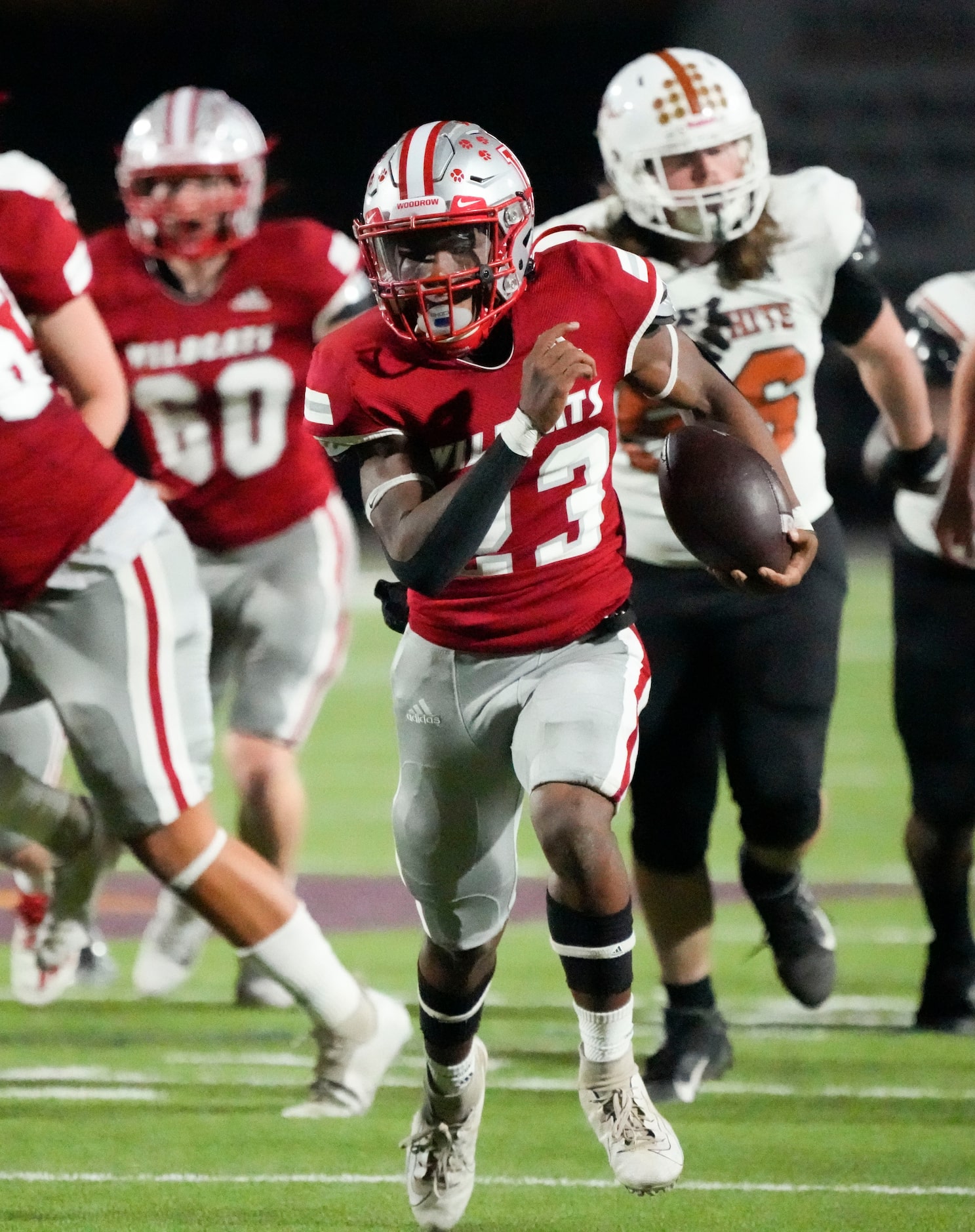 Woodrow Wilson junior running back Keitron Pearson (23) carries the ball during the first...