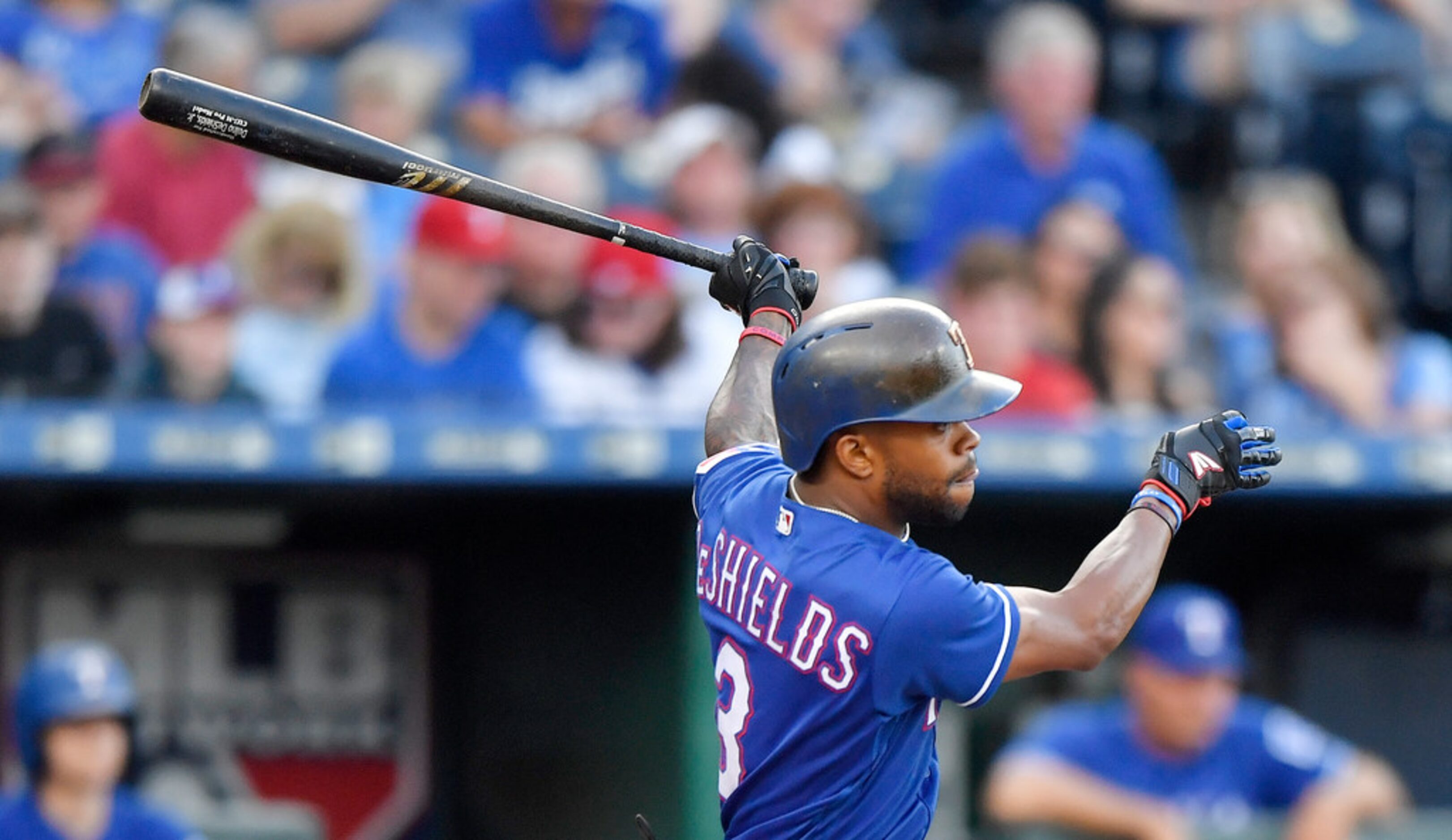 The Texas Rangers' Delino DeShields follows through on a two-run double in the second inning...