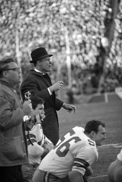 In this Jan. 1, 1967, photo, Dallas Cowboys coach Tom Landry shouts to his players on the...