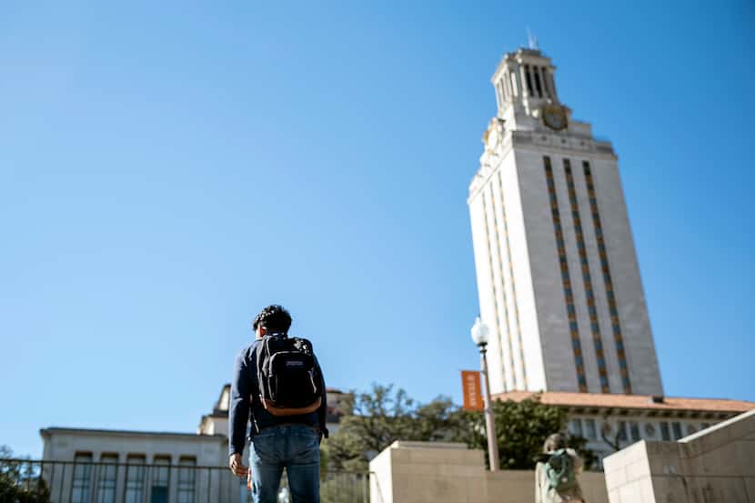 University of Texas at Austin student walks under the Texas Tower on his way to lunch before...