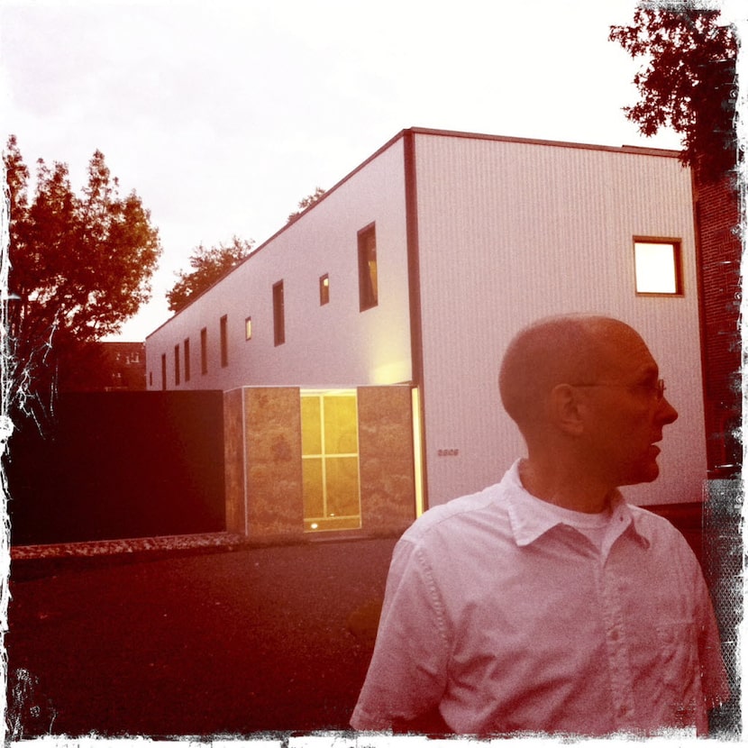 A 2011 iPhone photograph of Russell Buchanan taken in front of the house he designed on...