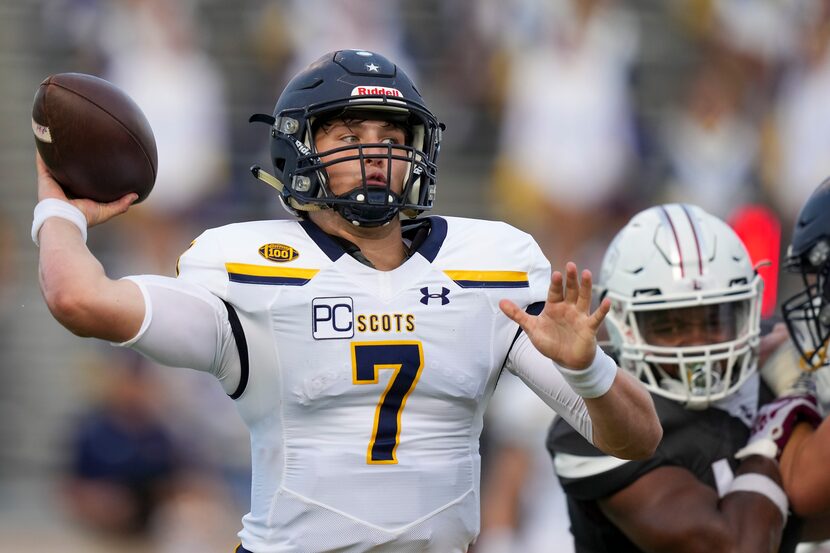 Highland Park quarterback  Brennan Storer (7) throws a pass during the first half of a high...