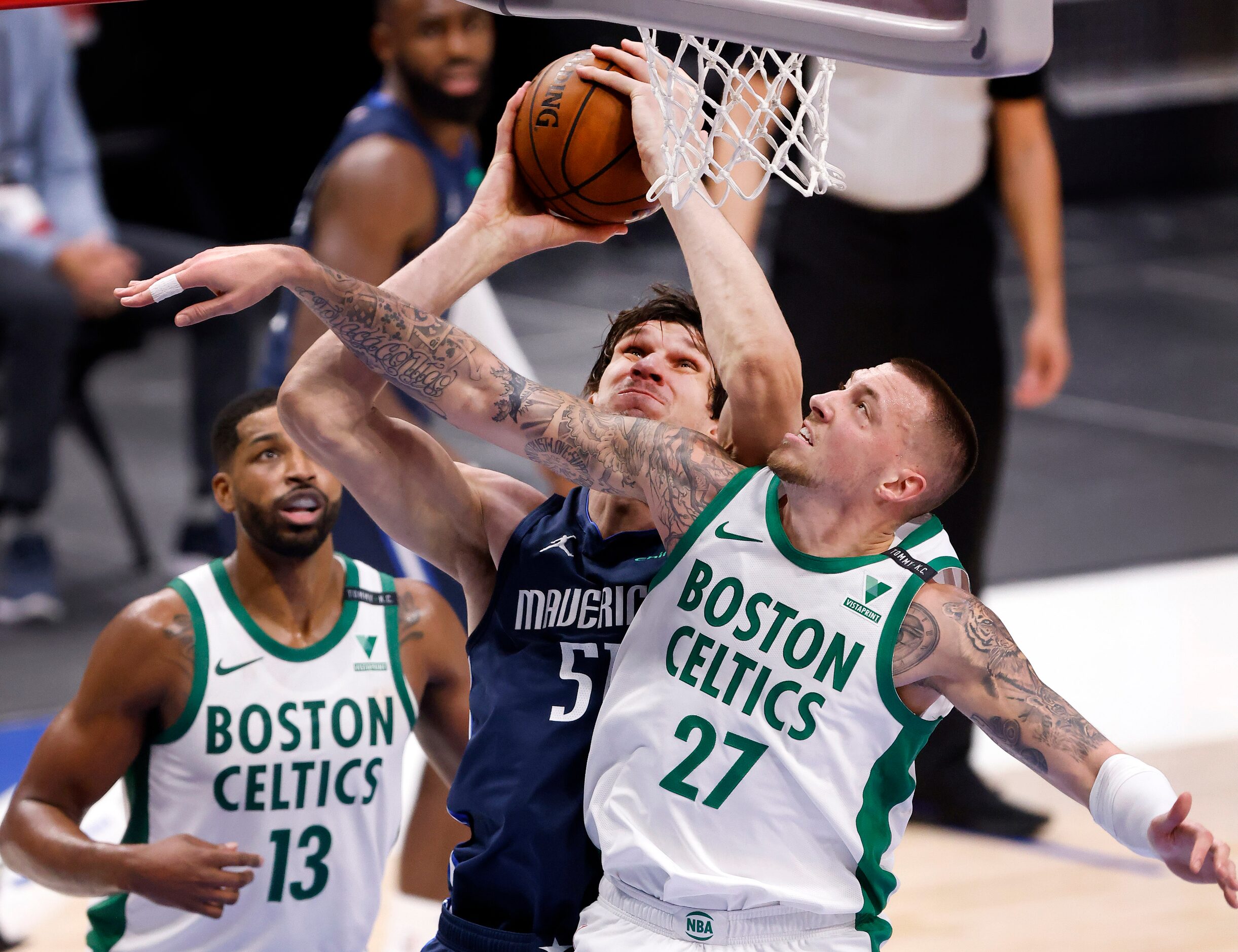 Dallas Mavericks center Boban Marjanovic (51) battles underneath for a shot against Boston...