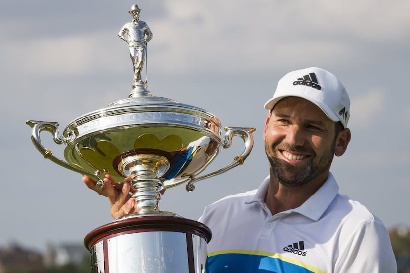 Sergio Garcia poses with the championship trophy after winning the AT&T Byron Nelson golf...