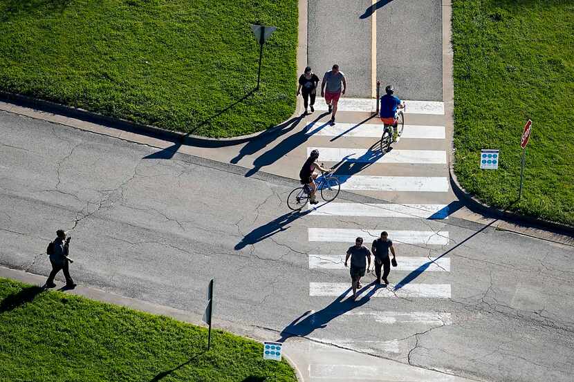 Aerial view of people cycling, walking and jogging on a trail at White Rock Lake in Dallas...