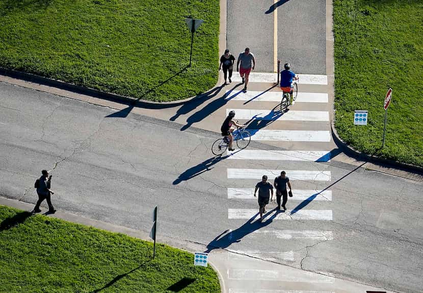 Aerial view of people cycling, walking and jogging on a trail at White Rock Lake in Dallas...