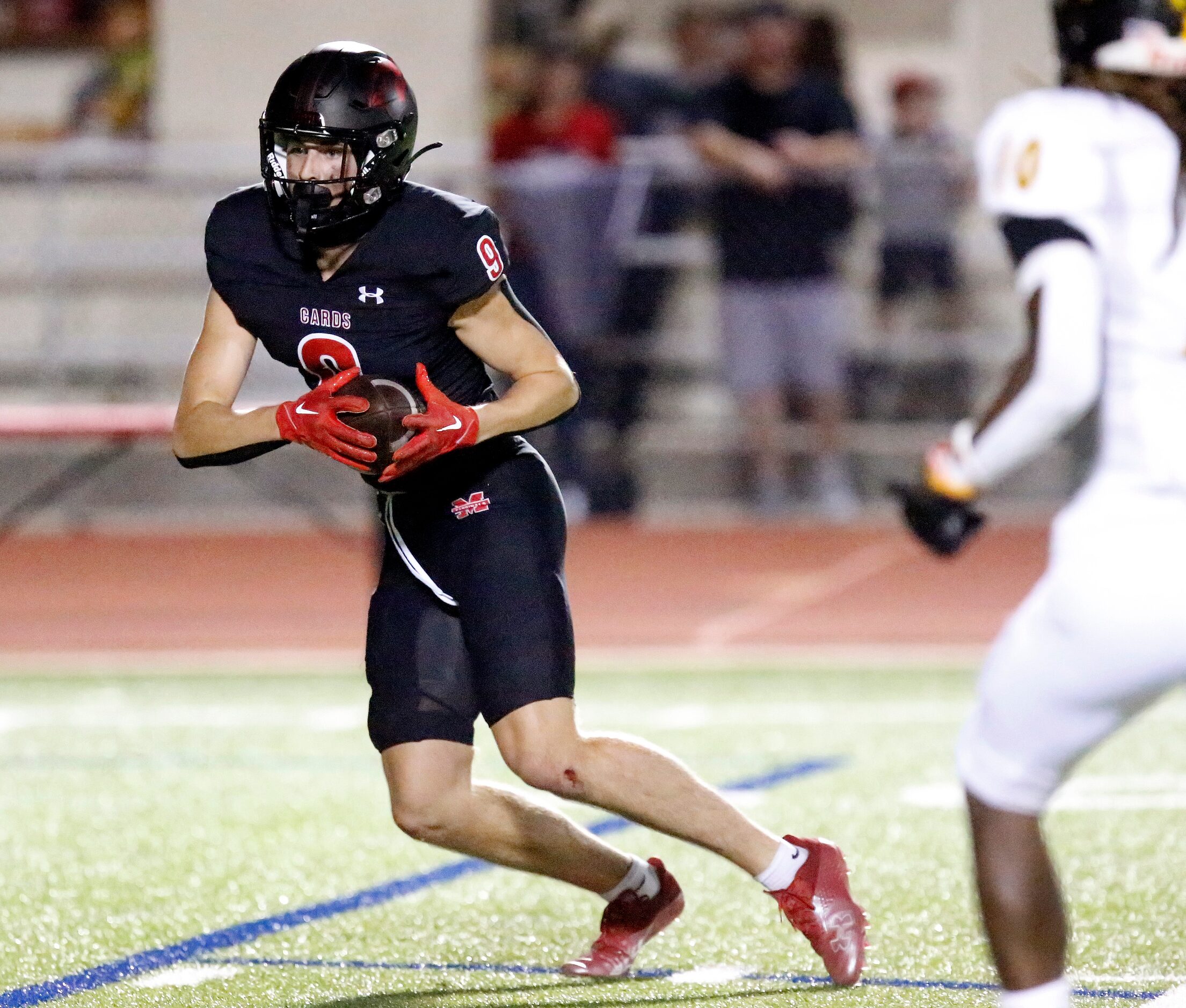 Melissa High School wide receiver Karson Maynard (9) heads for the end zone after a catch...