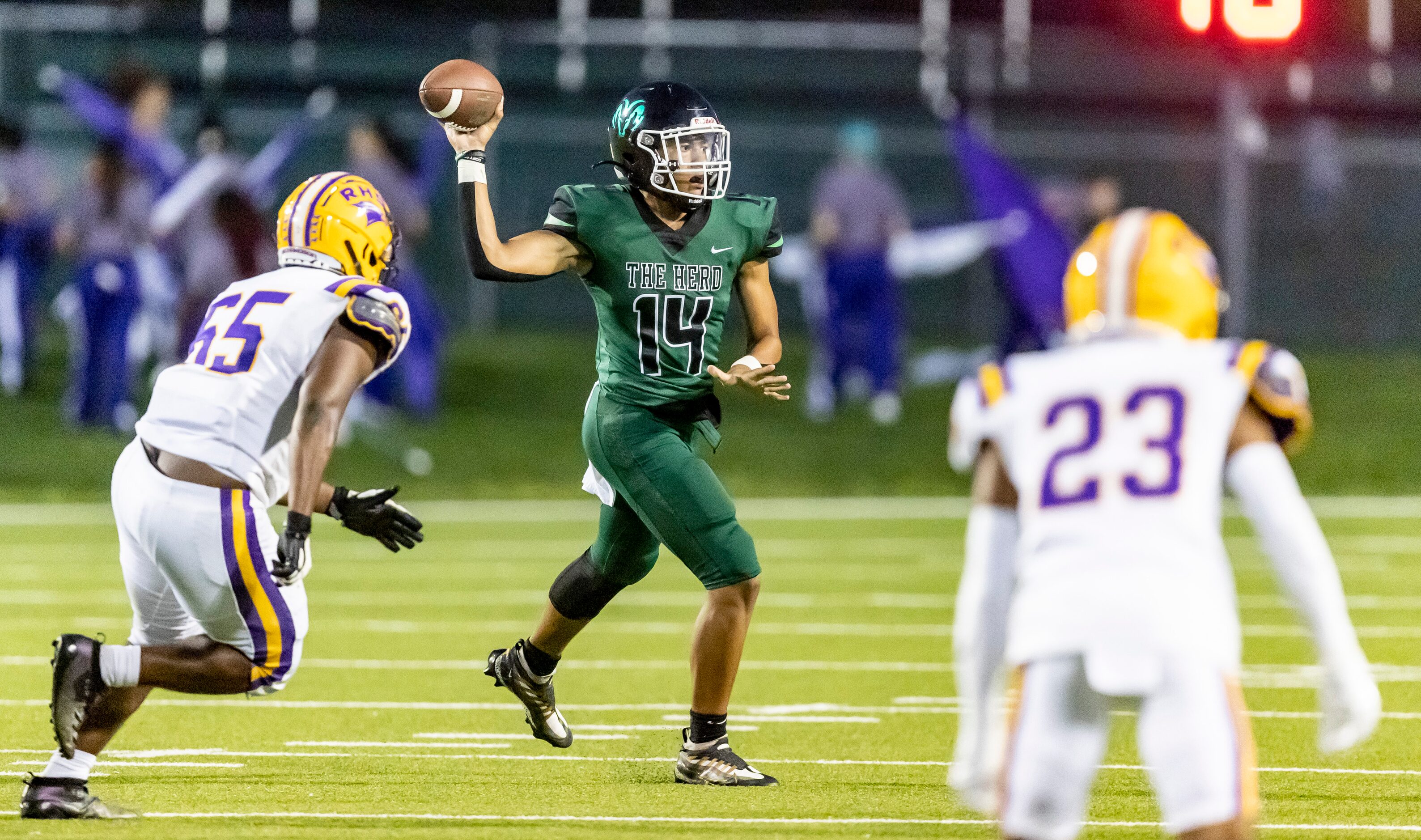 Berkner sophomore quarterback Cornell McGee IV (14) throws under pressure from Richardson...