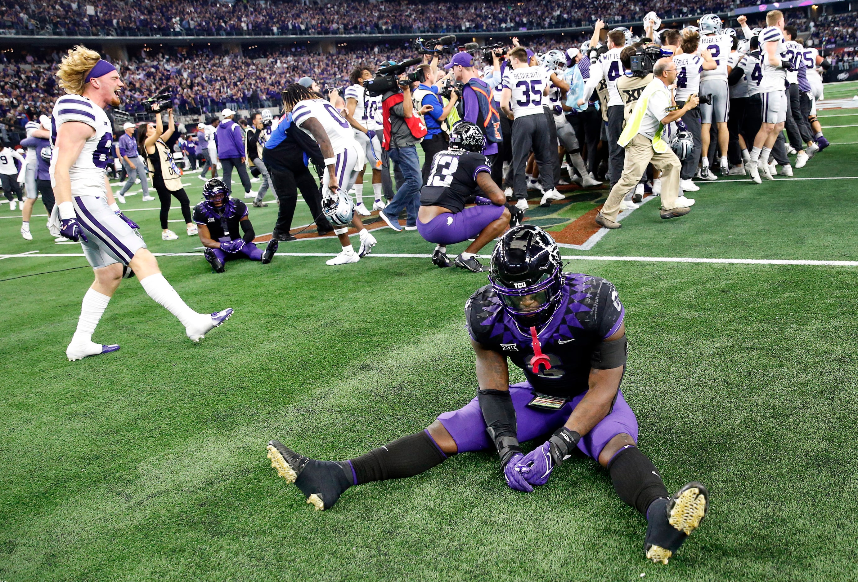 TCU Horned Frogs linebacker Jamoi Hodge (6) sits on the field as the Kansas State Wildcats...