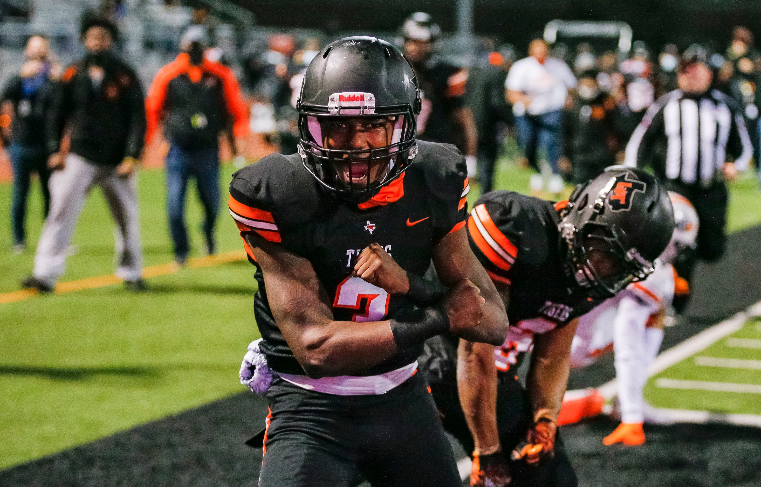 Lancaster junior quarterback Glenn Rice Jr. (3) celebrates scoring a touchdown during the...