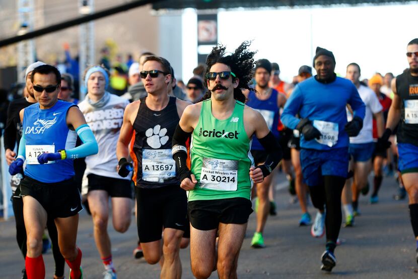 Runners begin the BMW Dallas Marathon in downtown Dallas on Dec. 10, 2017.
