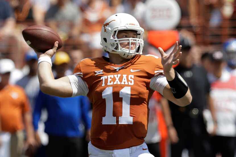 Texas quarterback Sam Ehlinger (11) throws against San Jose State during the first half of...