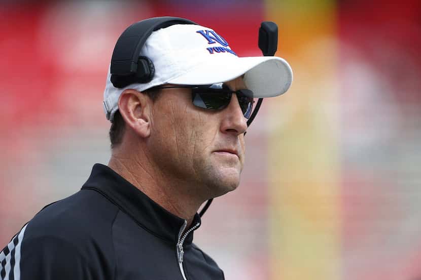 Kansas head coach David Beaty looks on from the sidelines during the first quarter against...