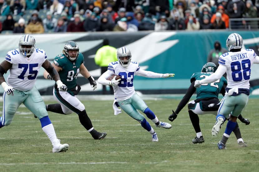 Dallas Cowboys' Terrance Williams runs with the ball during the first half of an NFL...