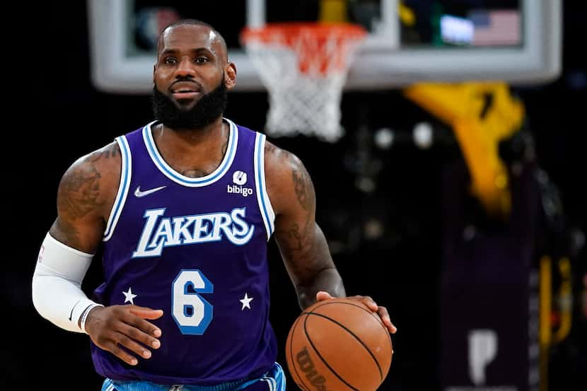 Los Angeles Lakers forward LeBron James (6) controls the ball during an NBA basketball game...