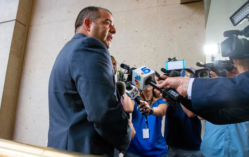 Mike Mata, president of the Dallas Police Association, gives remarks to the media following...