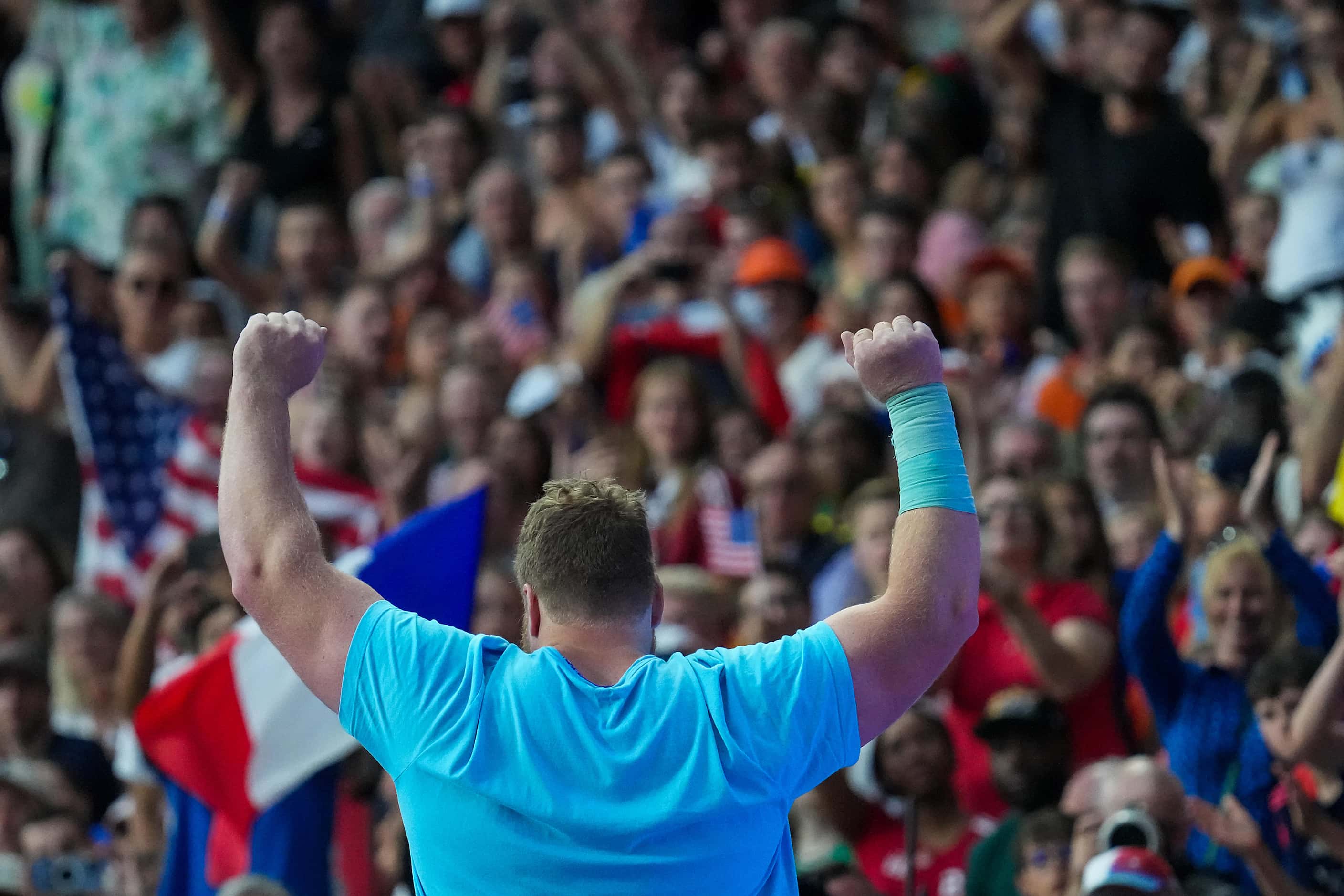 Ryan Crouser of the United States reacts to the crowd as he is introduced before the men’s...