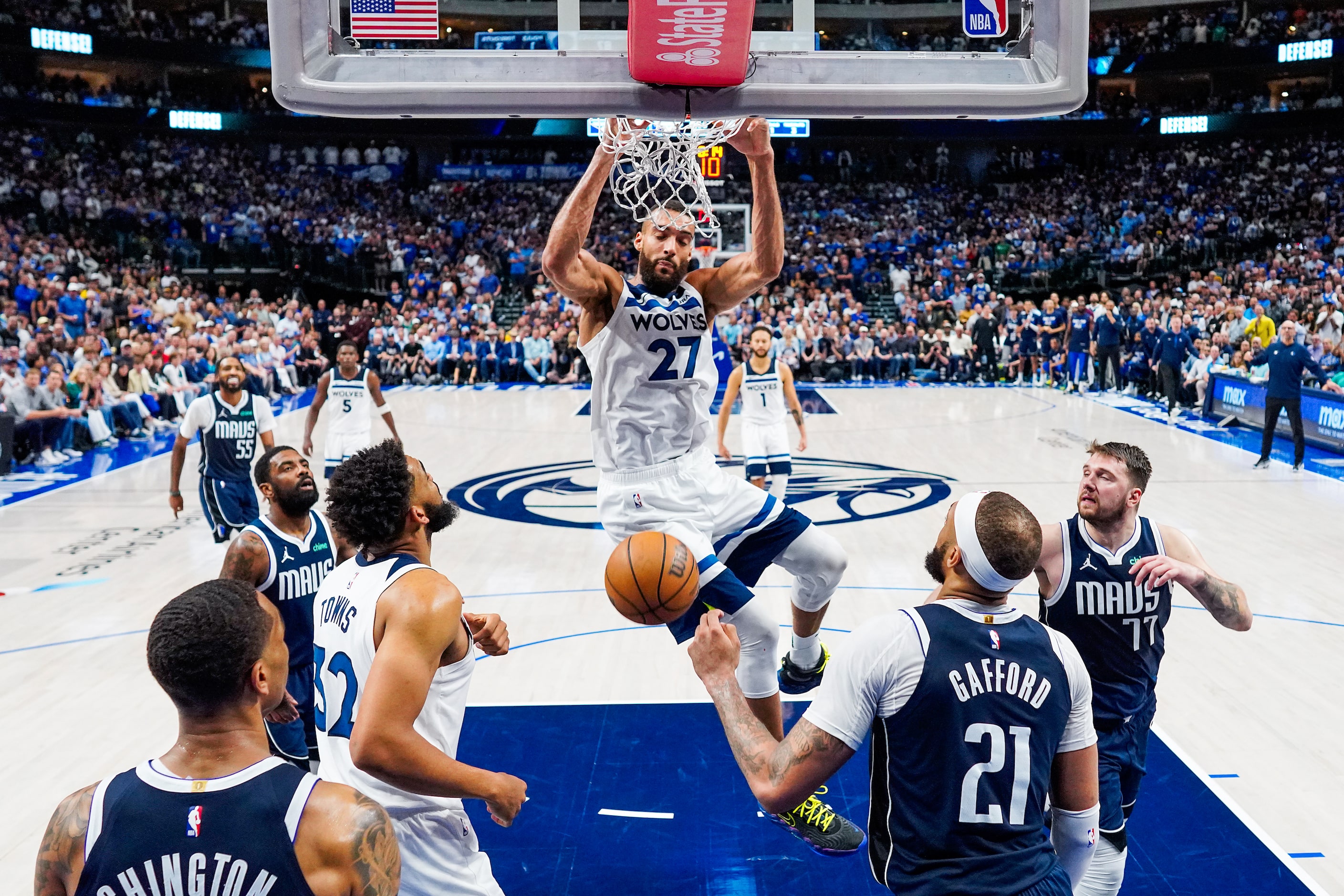 Minnesota Timberwolves center Rudy Gobert (27) dunks over Dallas Mavericks center Daniel...